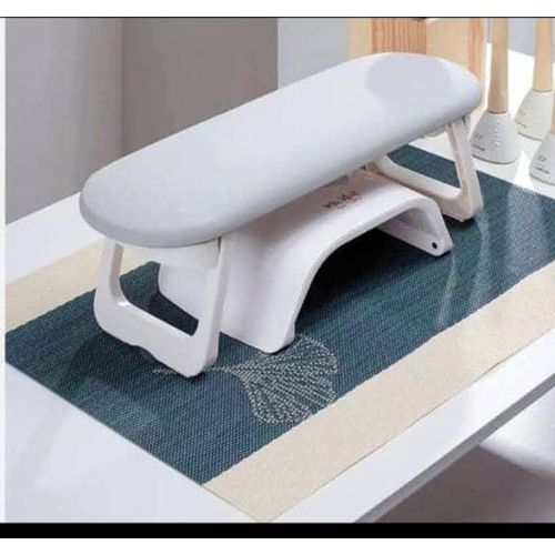 foldable nail arm rest designed to provide comfortable hand support for manicure and nail art sessions.