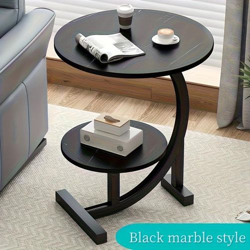 Modern luxury wrought iron and wood mixed side table with a marble-patterned black tabletop - a space-saving sofa/bedside coffee table with storage shelf.