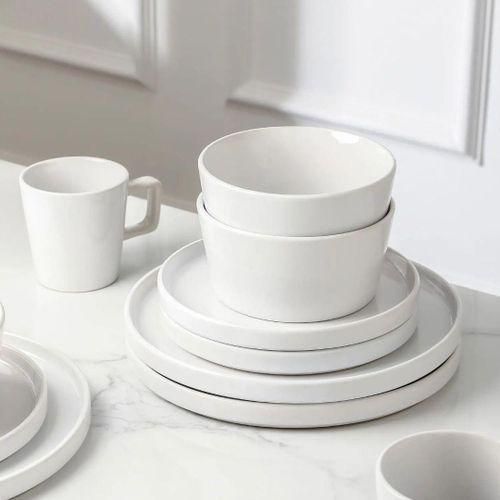 Double-layer design for extra storage Protective cover to keep dishes clean Space-saving over-the-sink design Strong and durable construction Allows water to drain directly into the sink Ideal for drying plates, bowls, cups, and utensils