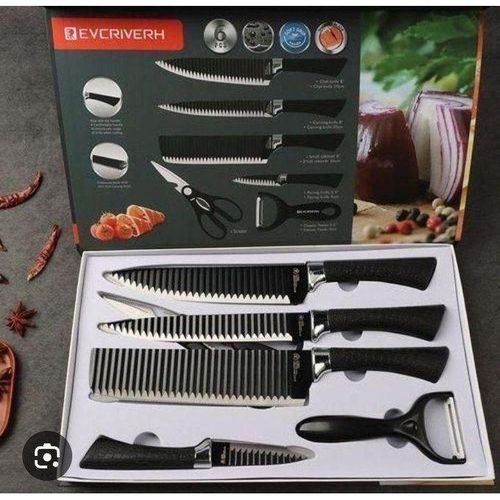 Black packed set of kitchen knives and scissor