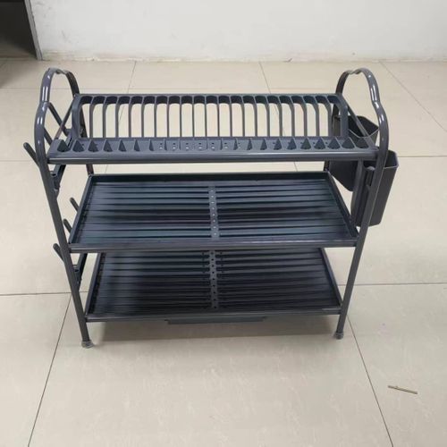 3-layer metal dish drying rack used to organize and dry plates, bowls, cups, and utensils on a kitchen counter.