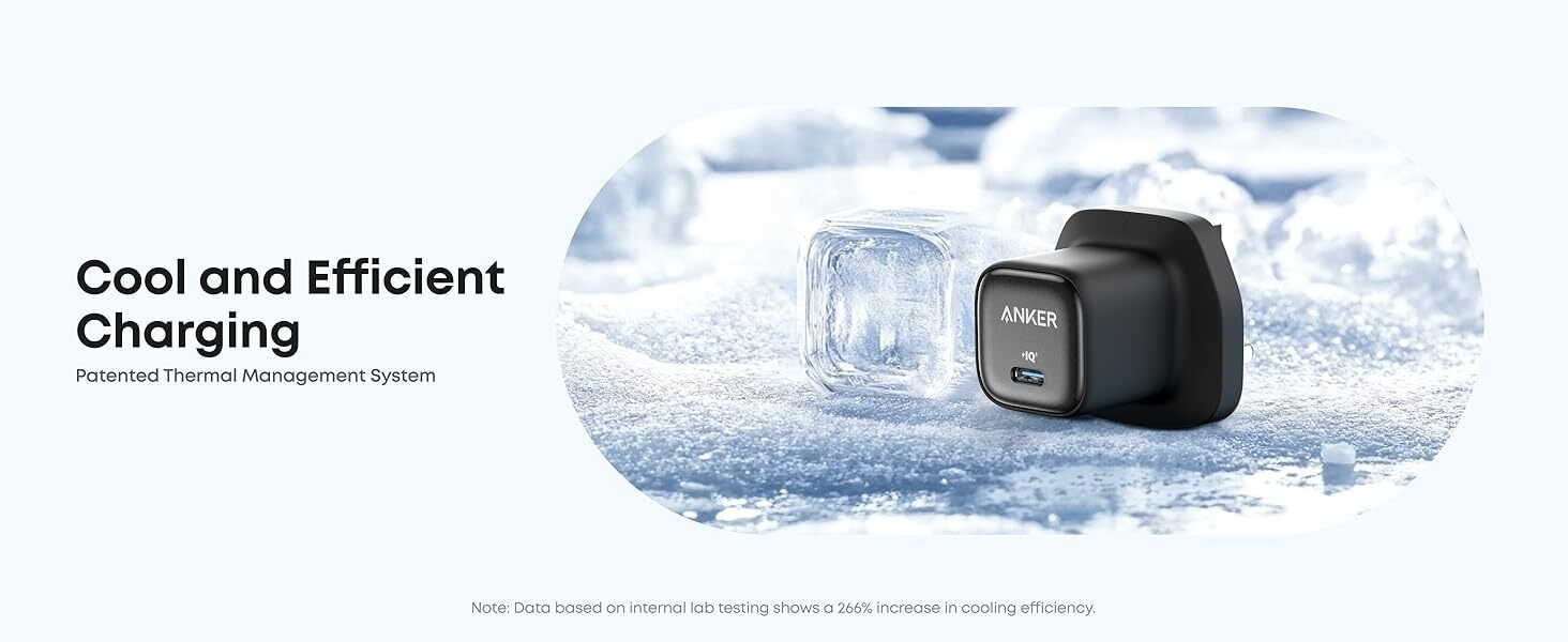 A compact black USB wall charger and a transparent cube-shaped cooling device on an icy surface, emphasizing efficient and cool charging capabilities.