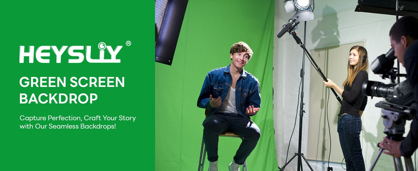 Green screen backdrop for video production. Shows studio setup with camera, lighting, and people using the green screen for filming or photography.