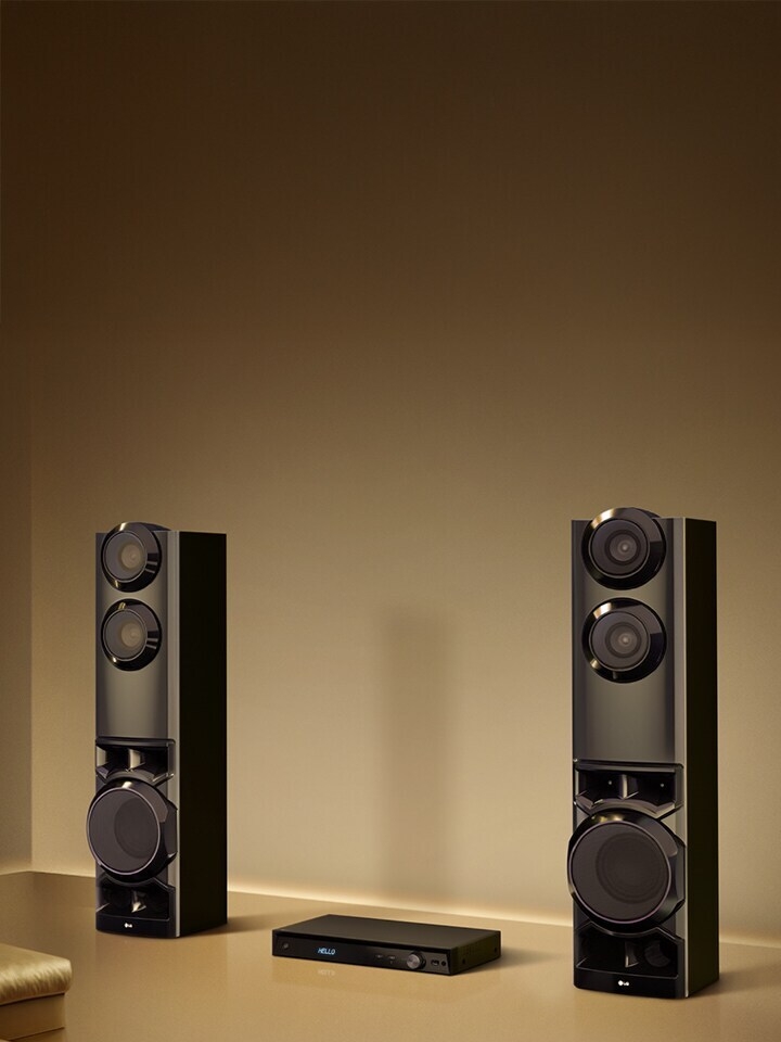 LG MR9 dual tower speaker system with 1250W sound and built-in subwoofers in a minimalist living space