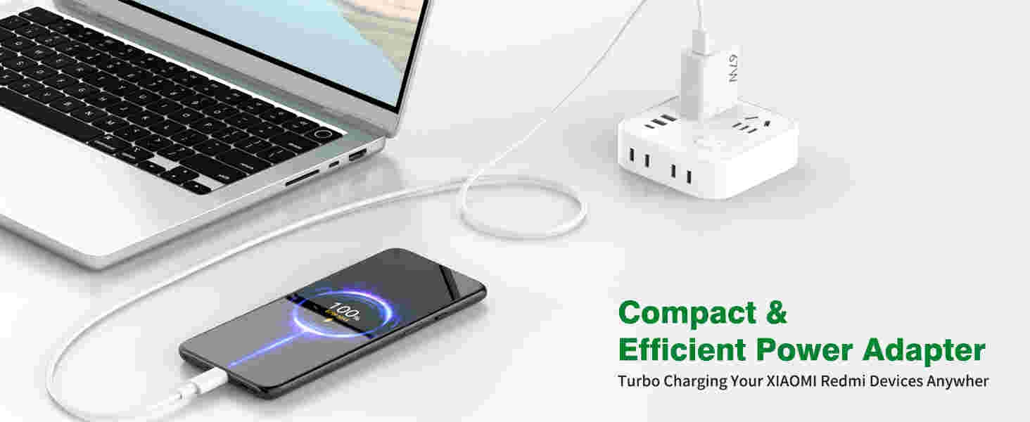 a laptop and a charging cable connected to a laptop.