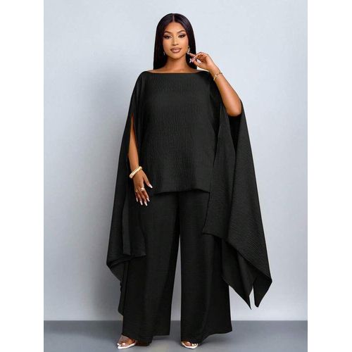 elegant black two piece top and trouser