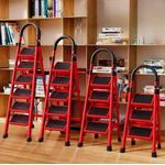 4-step foldable multipurpose ladder with a vibrant red finish and black non-slip steps.