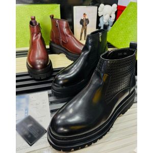 men's black leather platform Chelsea boots feature a chunky sole and textured side panels