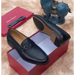 Black leather slip-on loafer.