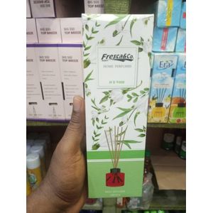 Fresca & Co. Oud Wood Home Perfume Reed Diffuser (100ml). This product functions as an ambient room air freshener that utilizes capillary action through porous wood sticks to steadily disperse premium fragrance oils into the air.