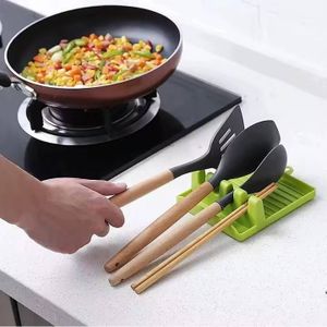 2-piece set features heat-resistant plastic spoon rests designed with multiple slots to hold spatulas, spoons, and small pot lids.