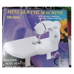 Electric mini sewing machine with foot pedal