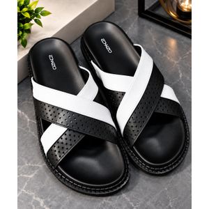 Stylish black and white cross-strap slides