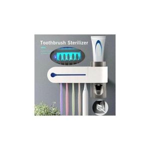 UV toothpaste dispenser and toothbrush sterilizer 