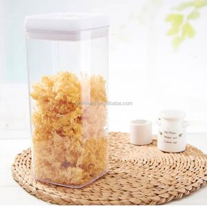rectangular, transparent acrylic airtight food storage container topped with a clean white lid