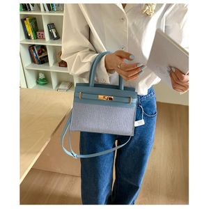 Classsy Blue Leather Office Handbag For Women With Unique Canvas Design