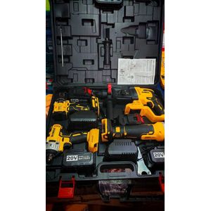 A Dewait cordless drill/driver, impact driver, and reciprocating saw and hammer combo kit. 