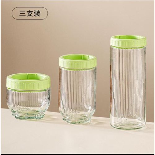 product_image_name-Generic-Three glass storage jars with light green airtight lids. -1