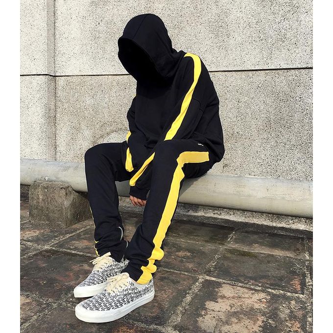 black joggers with yellow side stripe